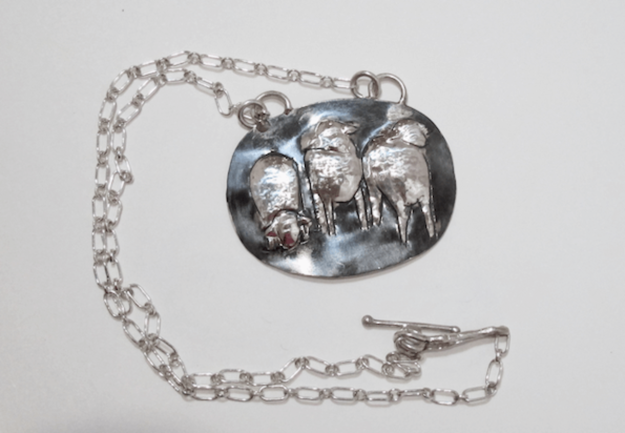 3 Sheep pendant necklace, a hand raised design with toggle clasp